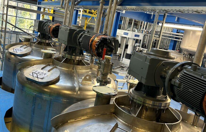 Installation of stainless steel mixing tanks with motors and piping
