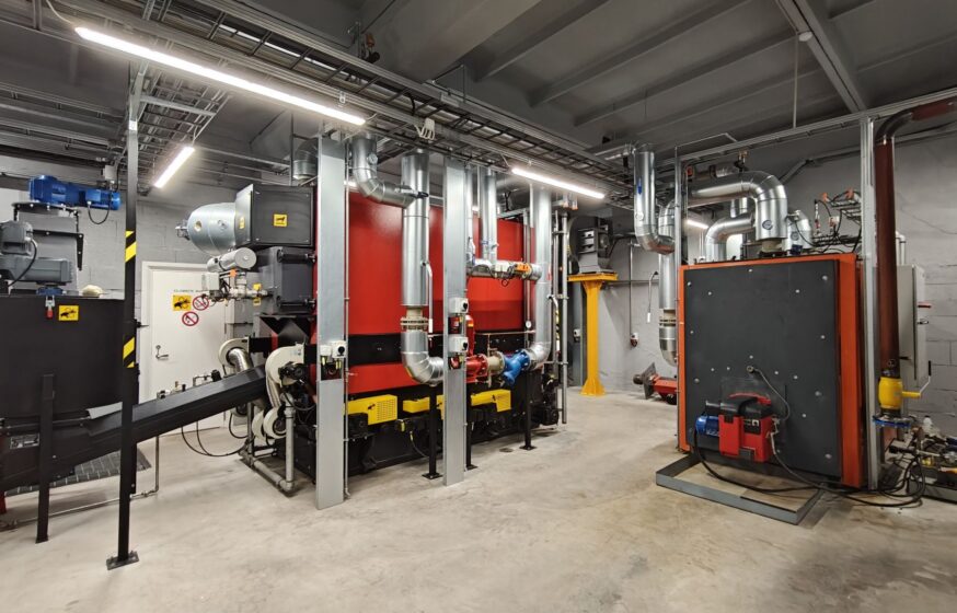 Biomass boiler room with installed boilers and piping in Rapla district heating plant