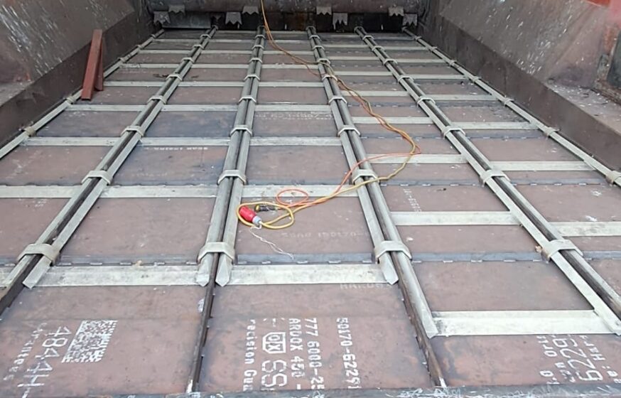 Completed industrial warehouse floor and scraper system installed by Tamult in Austria