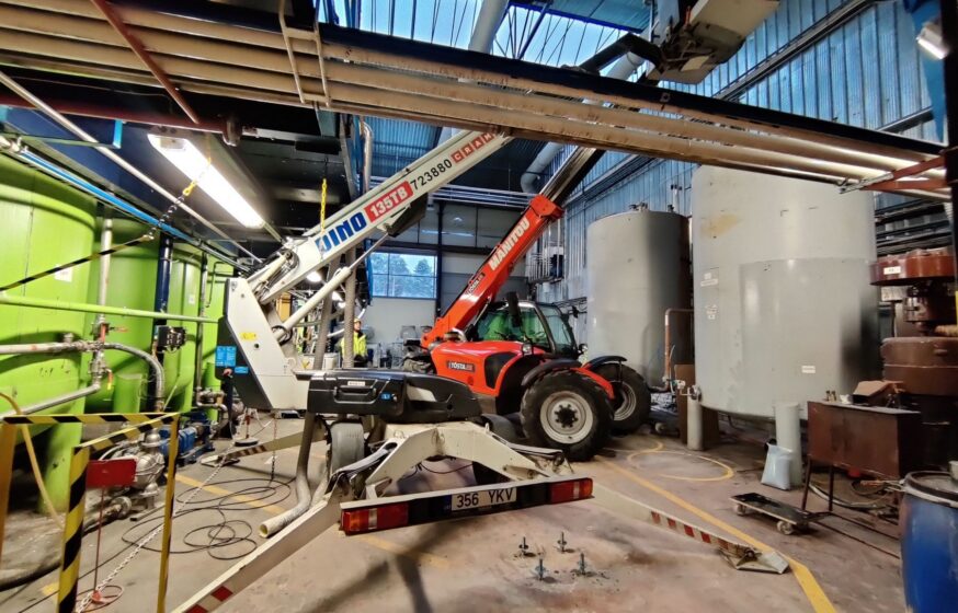 Mechanical installation work inside industrial production facility