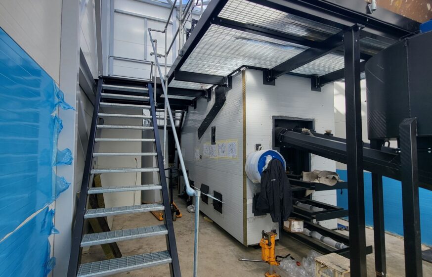 Service platforms and staircases installed around biomass boiler unit