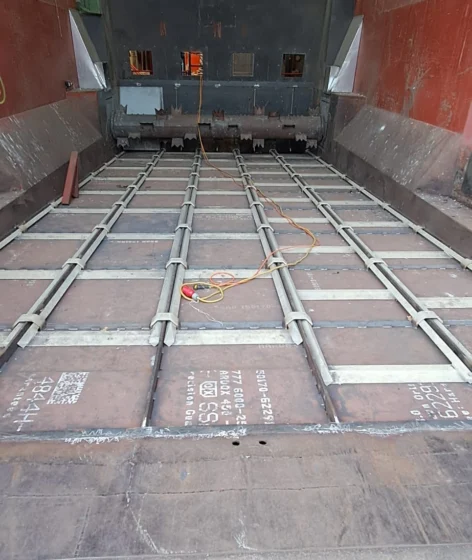 Completed industrial warehouse floor and scraper system installed by Tamult in Austria