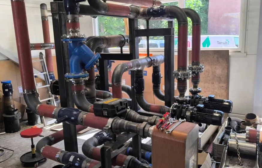 Internal piping and equipment installation inside district heating boiler plant