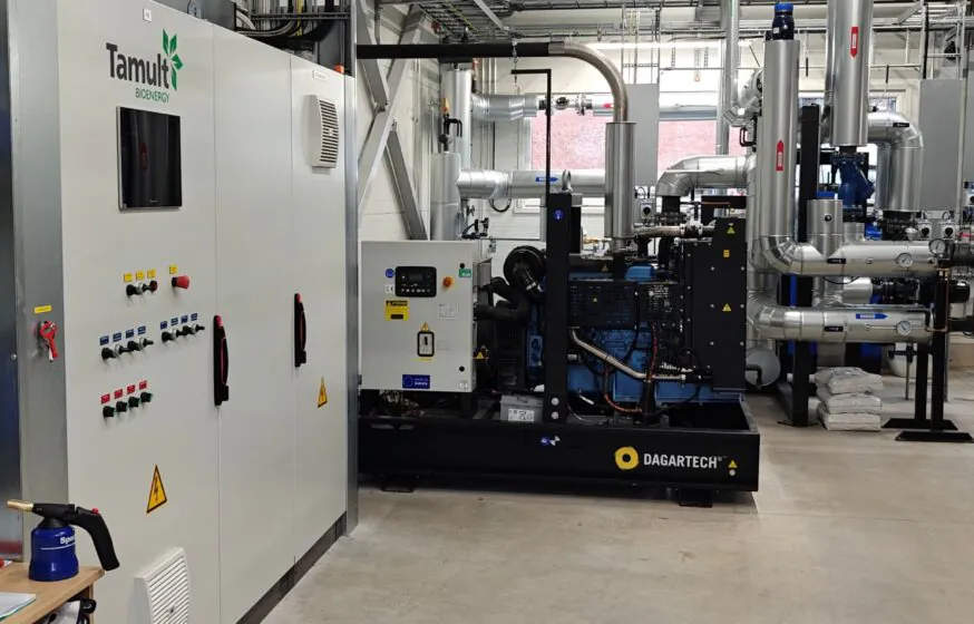 Biomass boiler house control panel and auxiliary generator installation at Aravete district heating plant